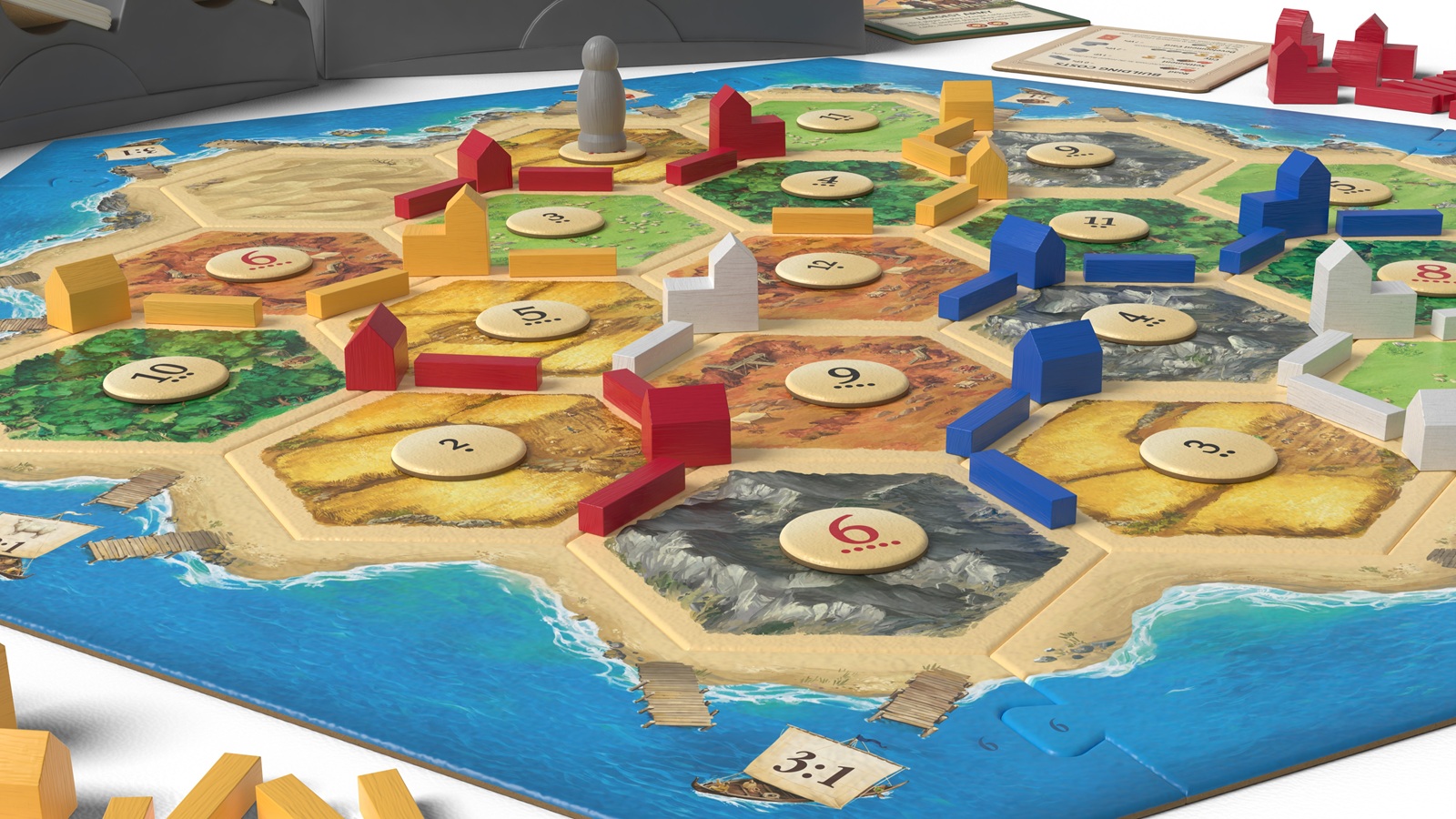 Catan board game showing the wooden game pieces
